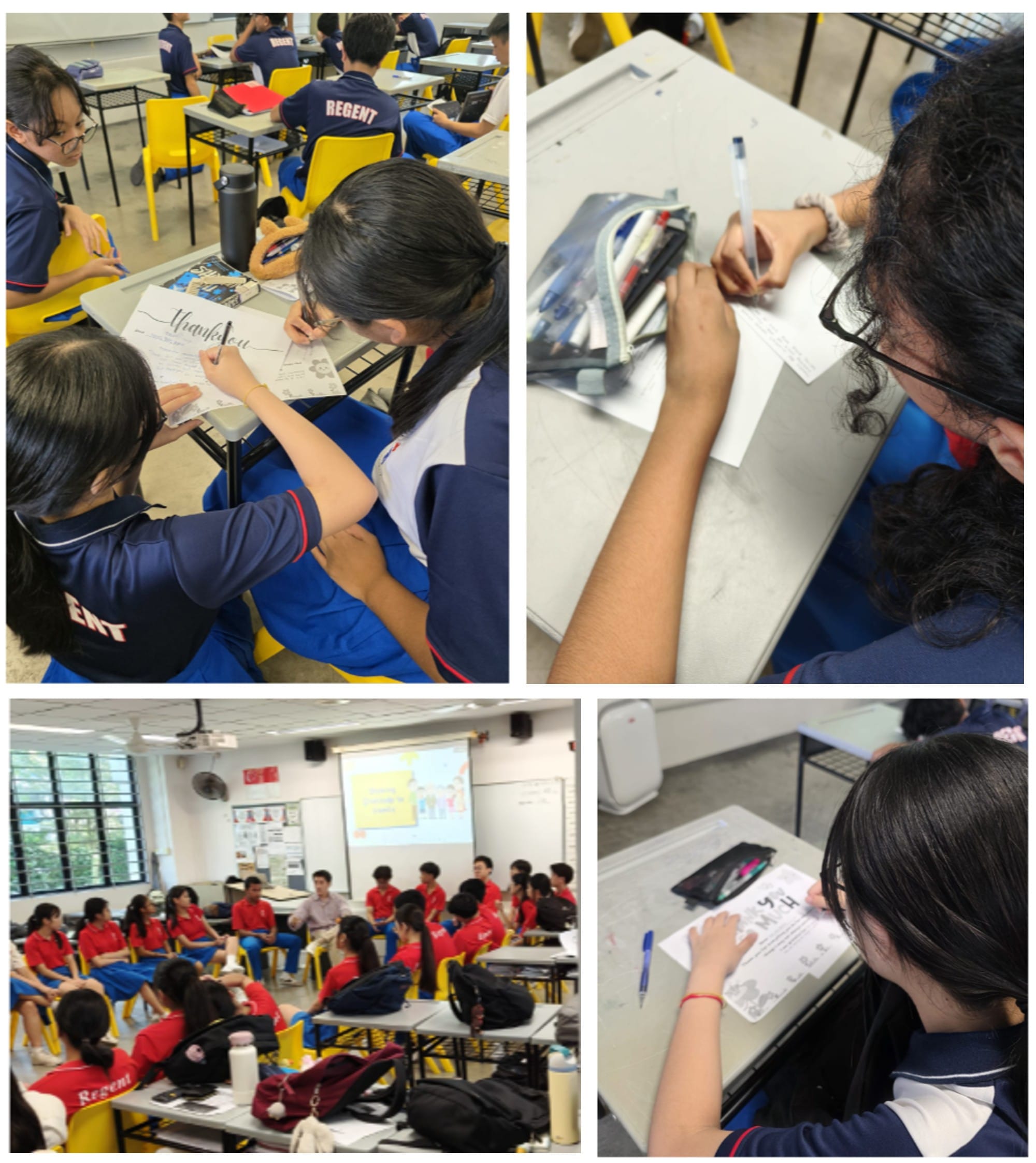 Students in blue and red uniforms sit in a classroom writing on papers, with one group gathered in a circle.