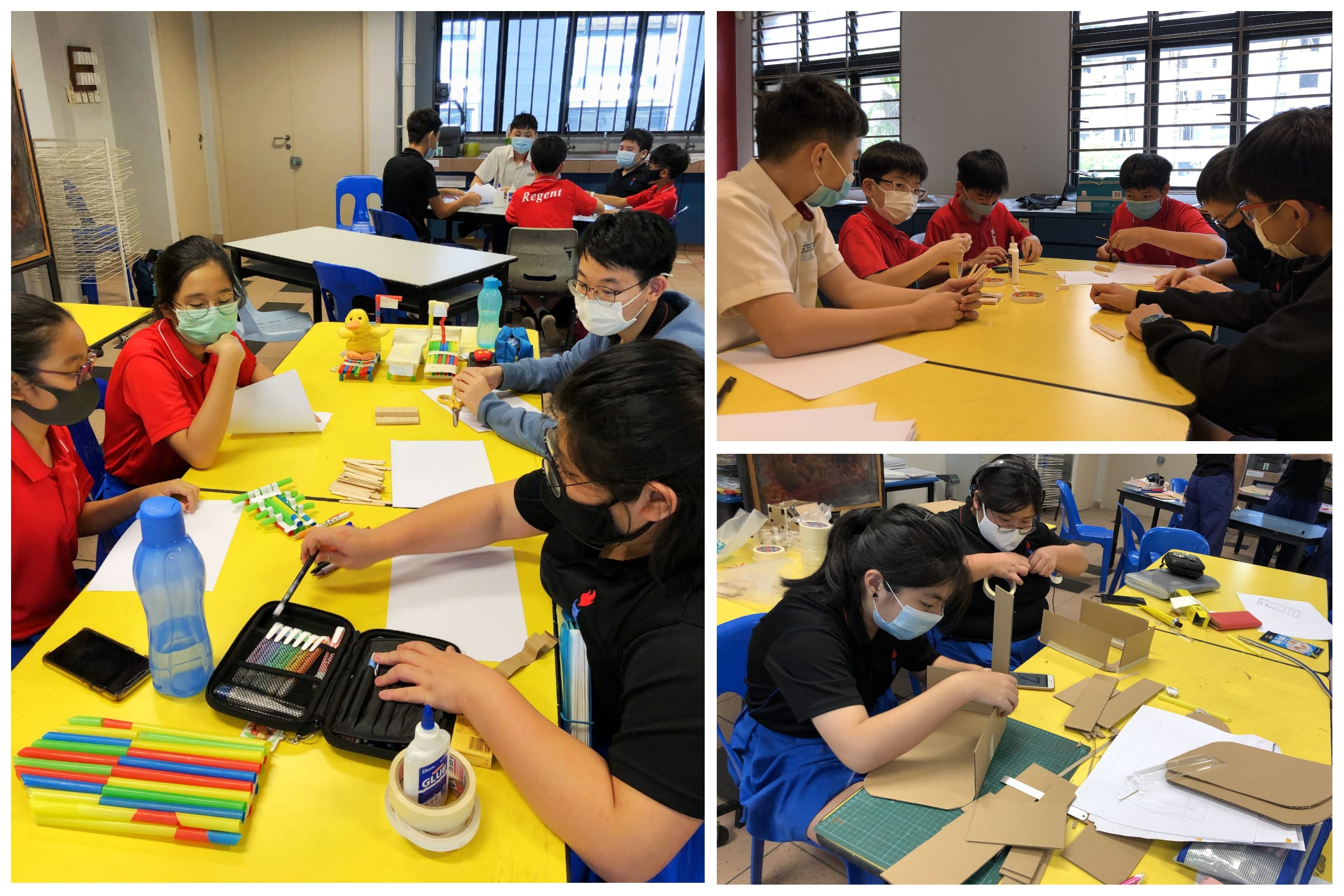Students wearing masks work at yellow tables with markers, craft sticks, paper, and cardboard projects.