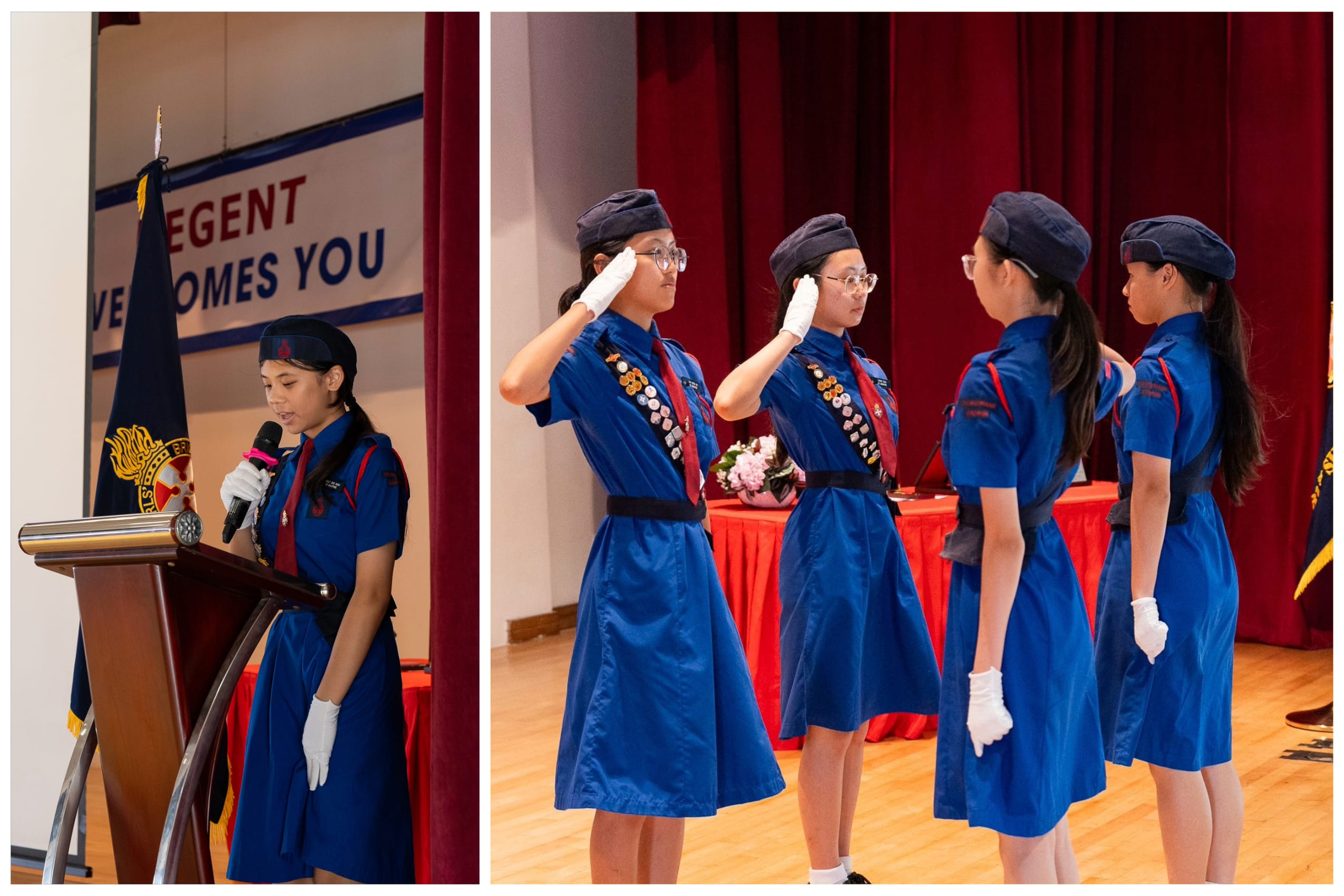 Girls in blue scout uniforms with caps salute on stage; one speaks at a podium during a formal ceremony.
