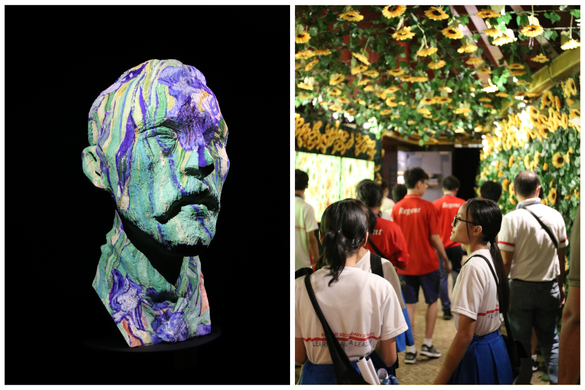 Colorful painted bust sculpture beside students in uniforms walking through a sunflower-decorated exhibition hall.