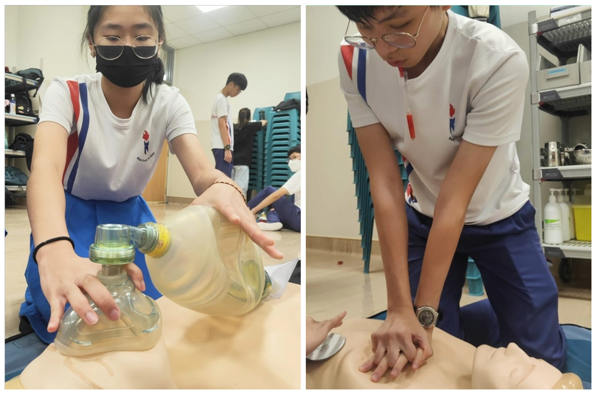 Two students practice CPR on mannequins, one using a bag-valve mask and the other performing chest compressions.