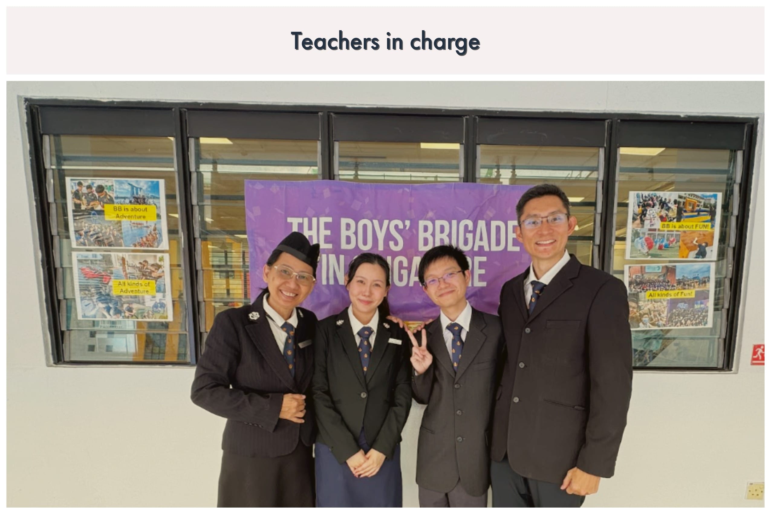 Four people in dark uniforms smile in front of a purple Boys' Brigade in Singapore banner.