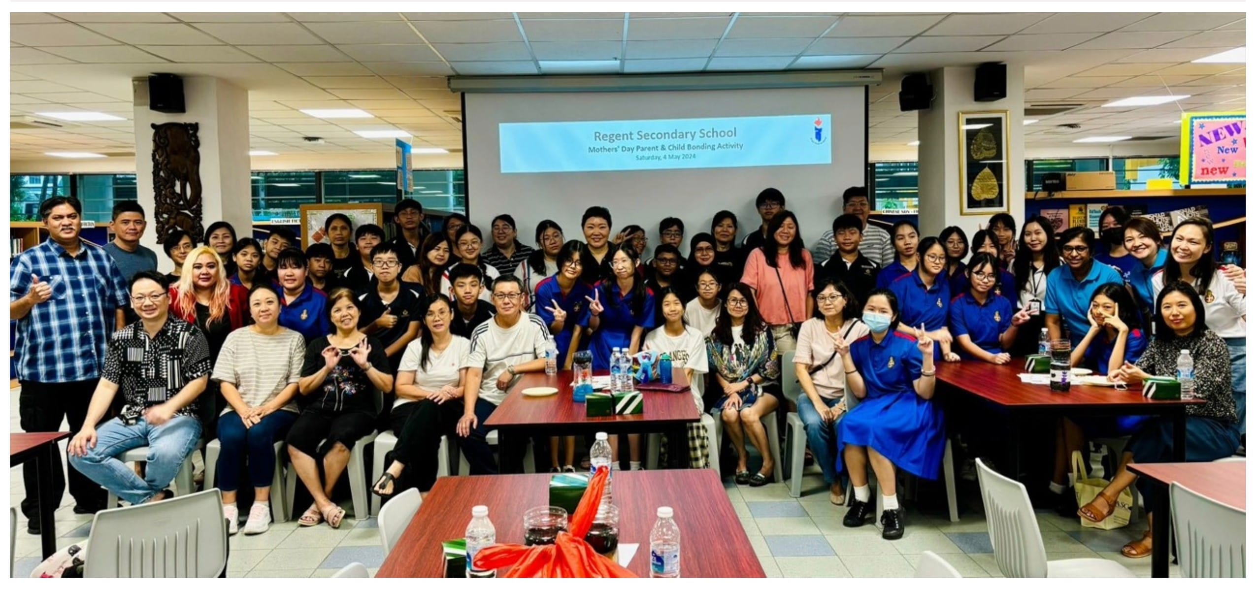 Large group of students and adults posing at Regent Secondary School Mothers' Day Parent and Child Bonding Activity.