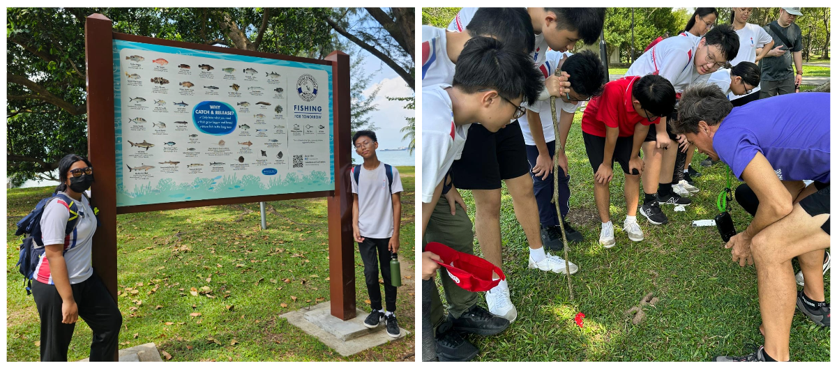 Two people stand by a catch and release fishing sign outdoors, while a group of students huddle over something on grass.