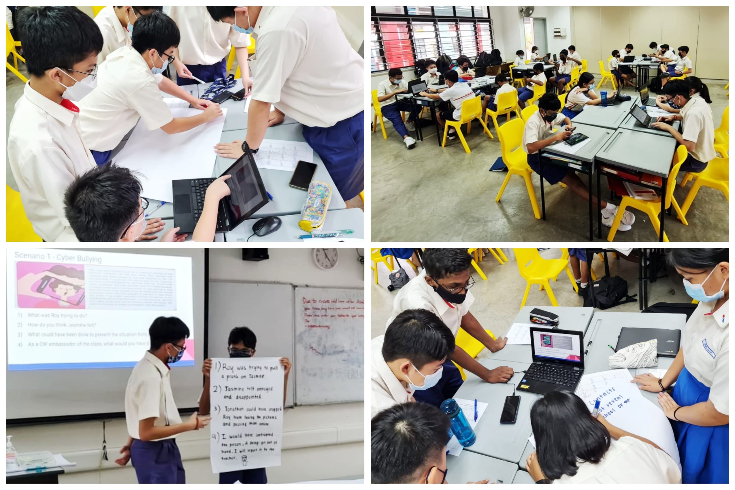 Students in school uniforms and masks work on laptops and posters during a cyber bullying awareness classroom lesson.