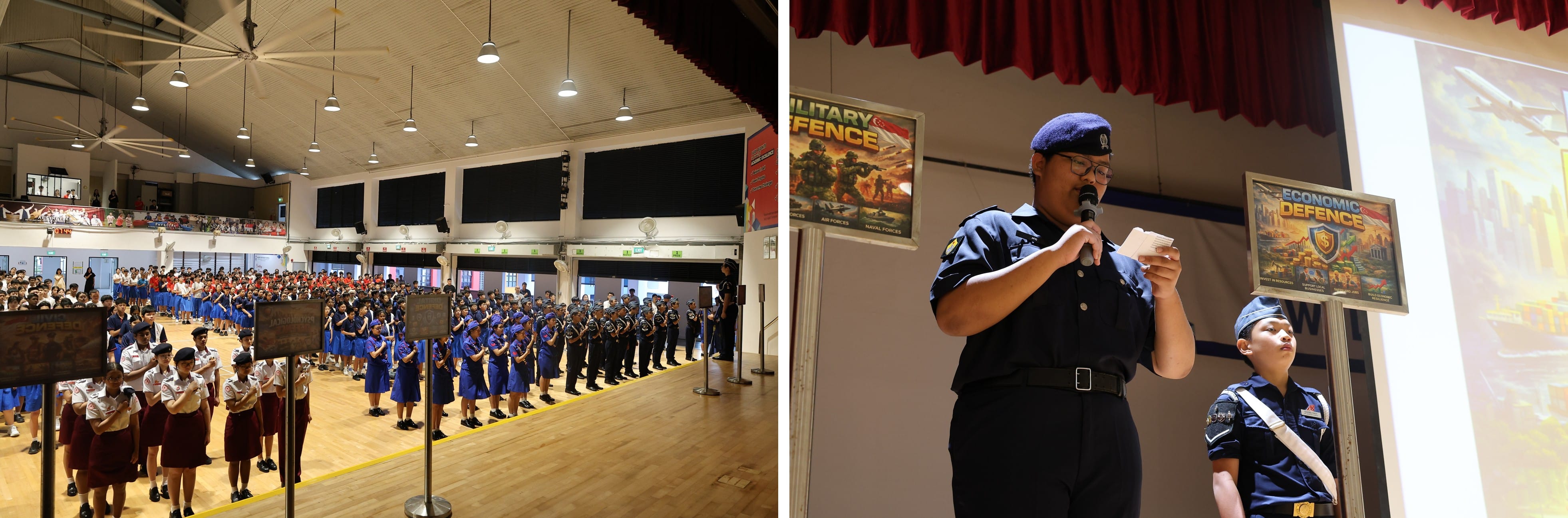 Students in uniform stand in a school hall assembly; a cadet speaks at a microphone on stage near defence posters.