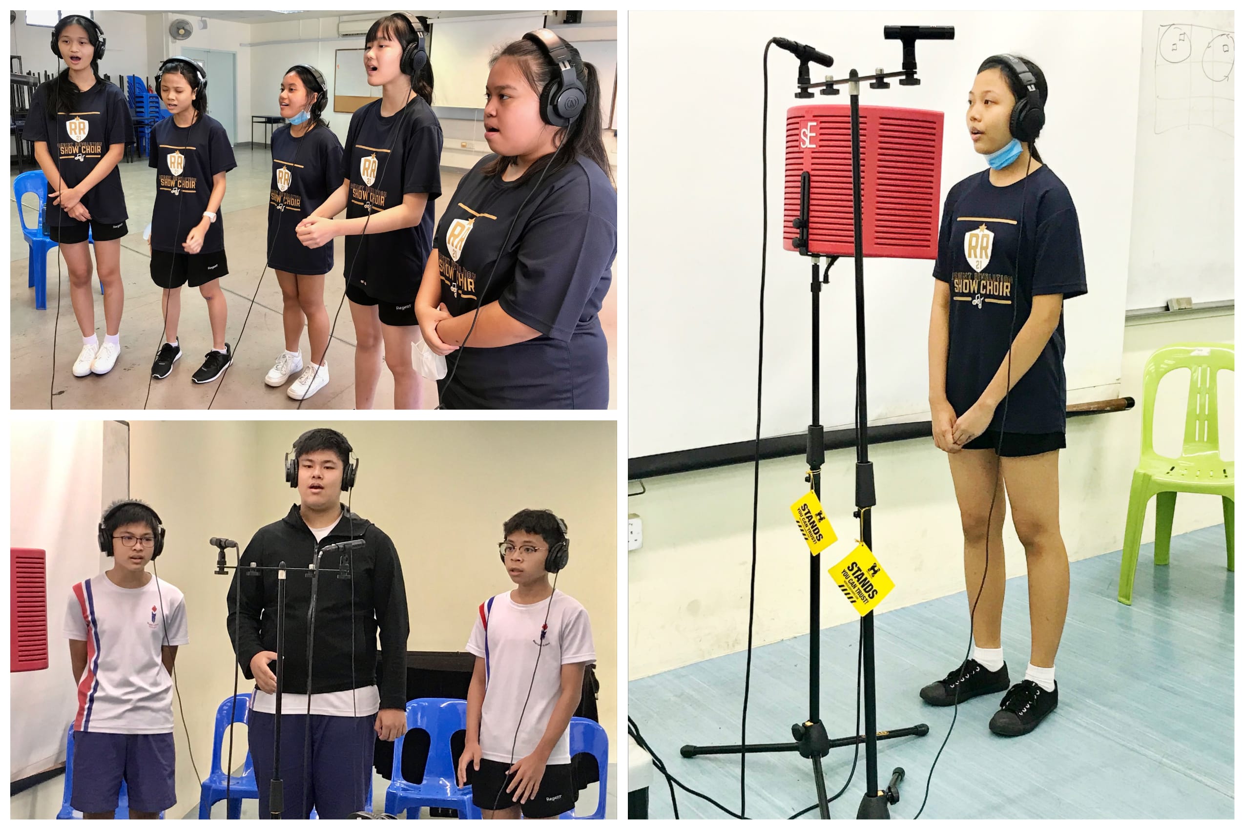 Students wearing headphones sing into microphones during a show choir recording session in a school room.