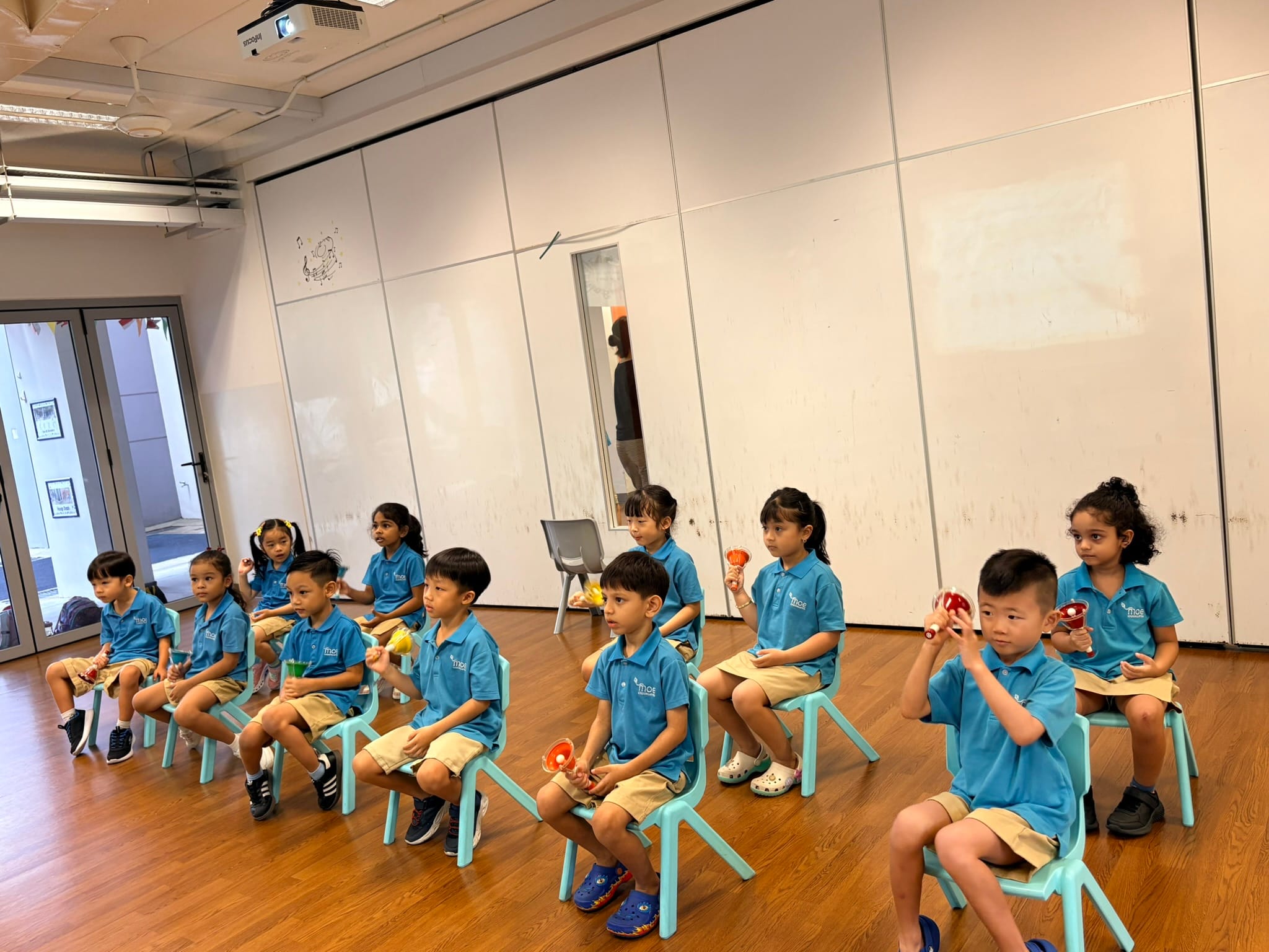 This is an image of children learning how to play handbells