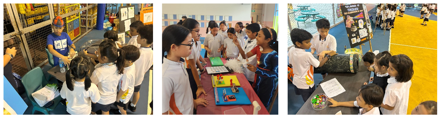SDPS students gathering around tables with science project displays and experiments.