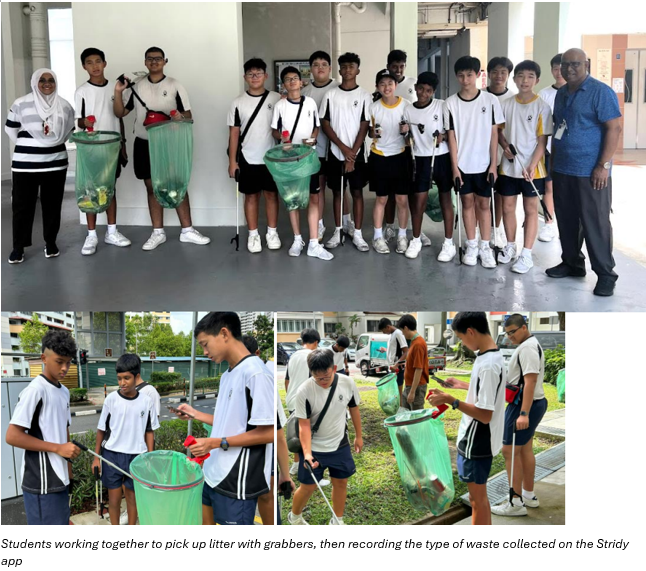 Students in white uniforms holding litter grabbers and green trash bags during an outdoor cleanup activity.