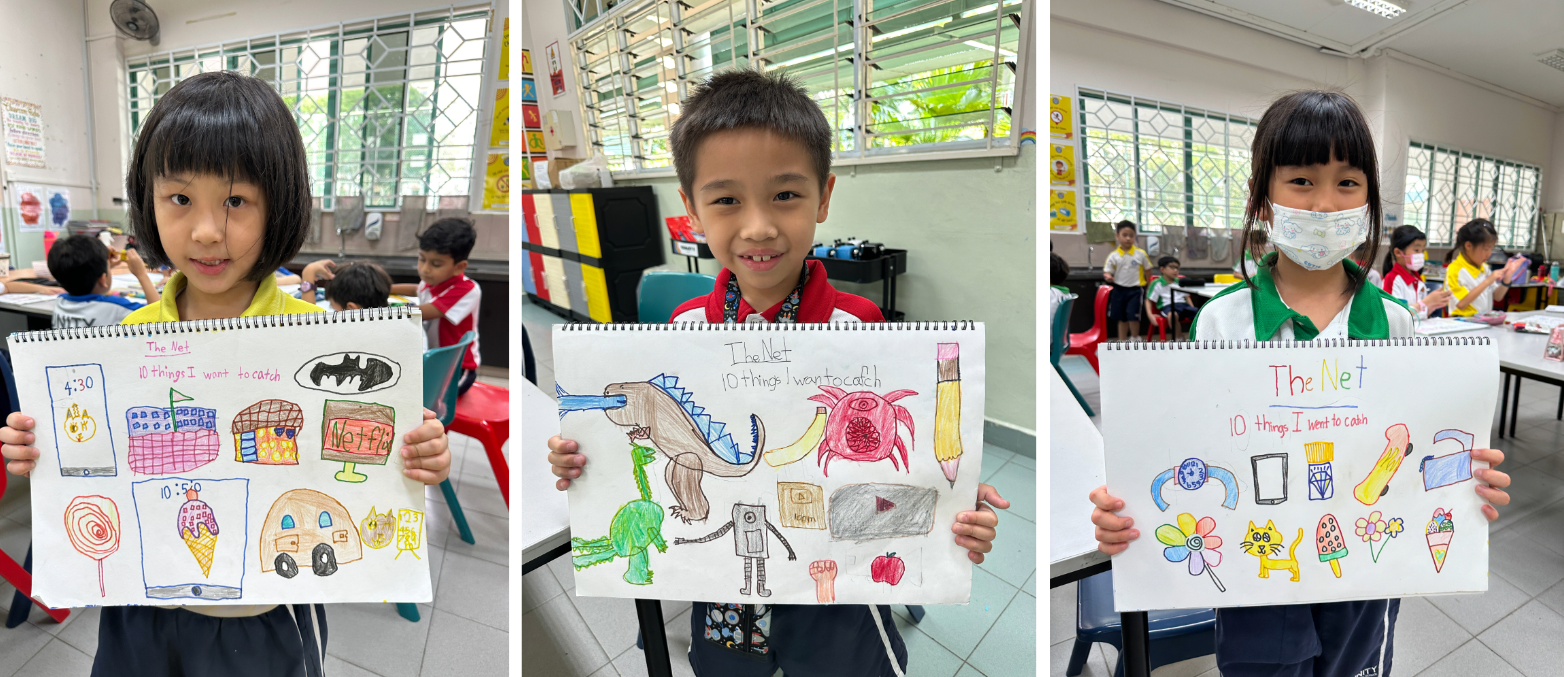 Three young students each hold up colorful hand-drawn artwork titled "The Net: 10 Things I Want to Catch" in a classroom.