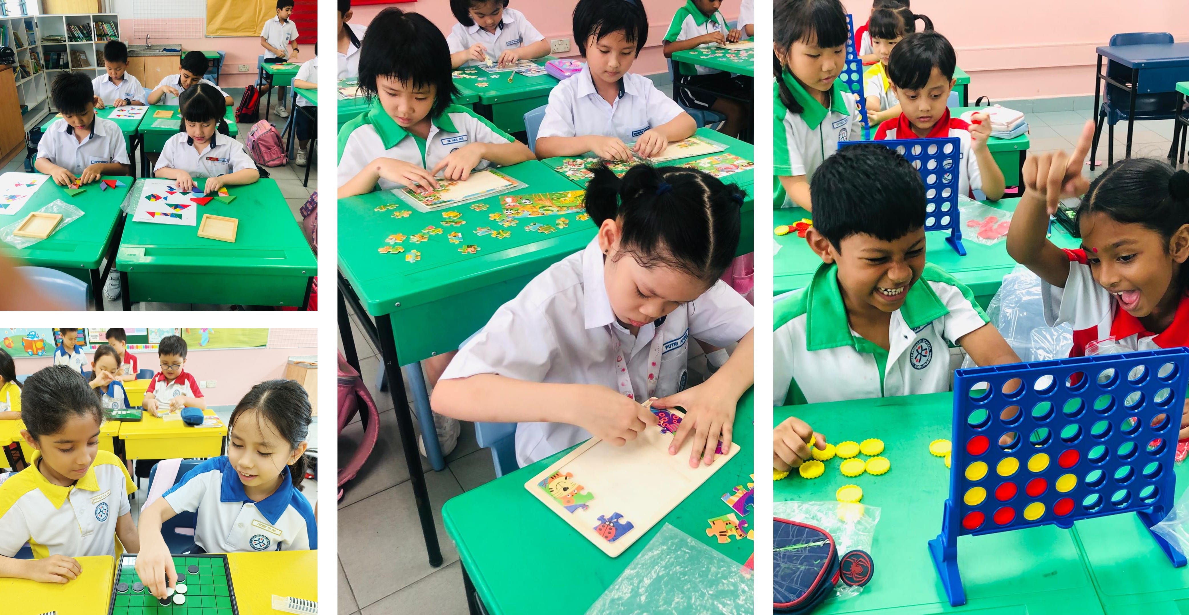 Young students in uniforms play board games, puzzles, and Connect Four at green and yellow desks in a classroom.