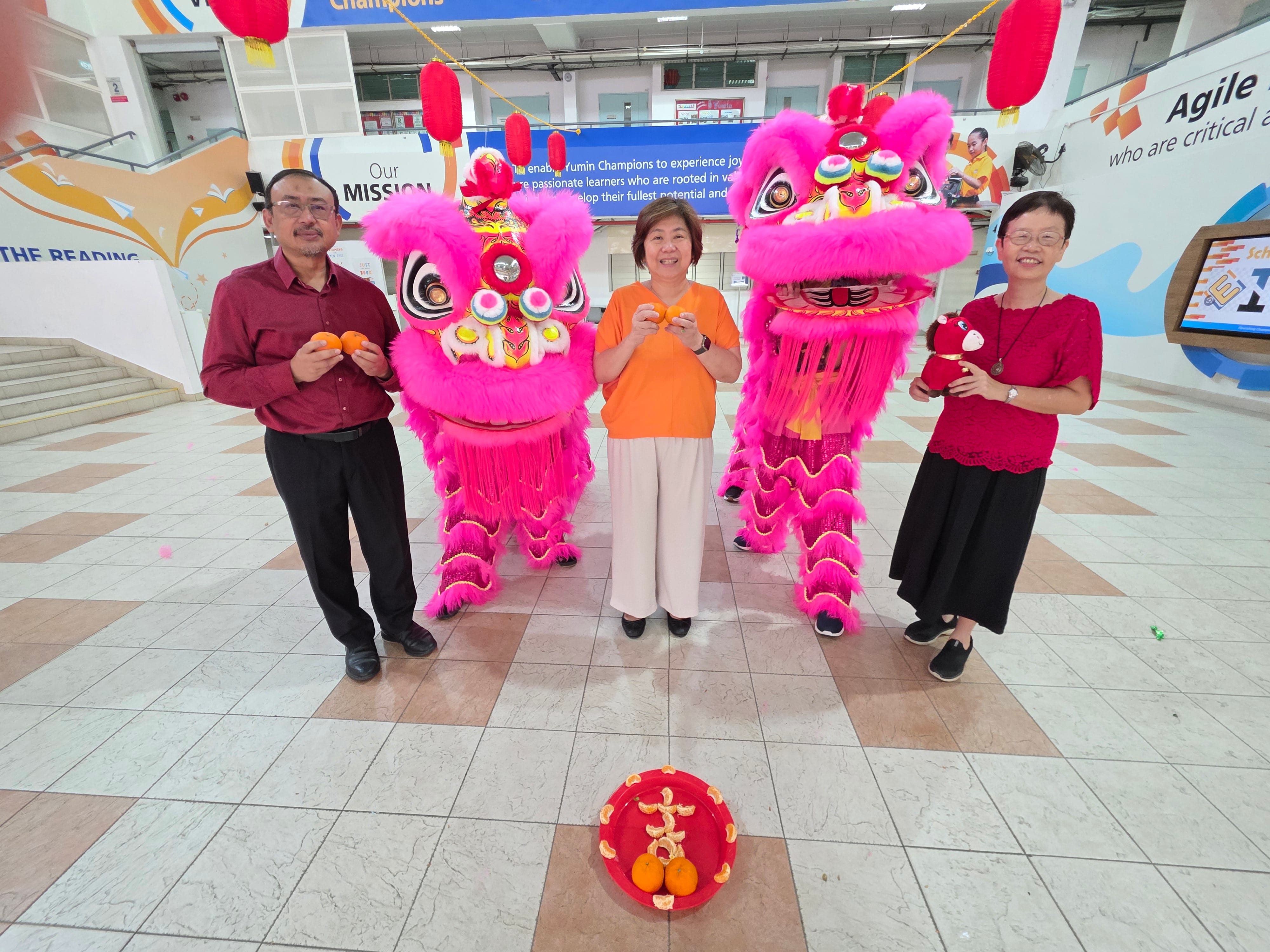 Our School Leaders with the lion dancers during CNY event.