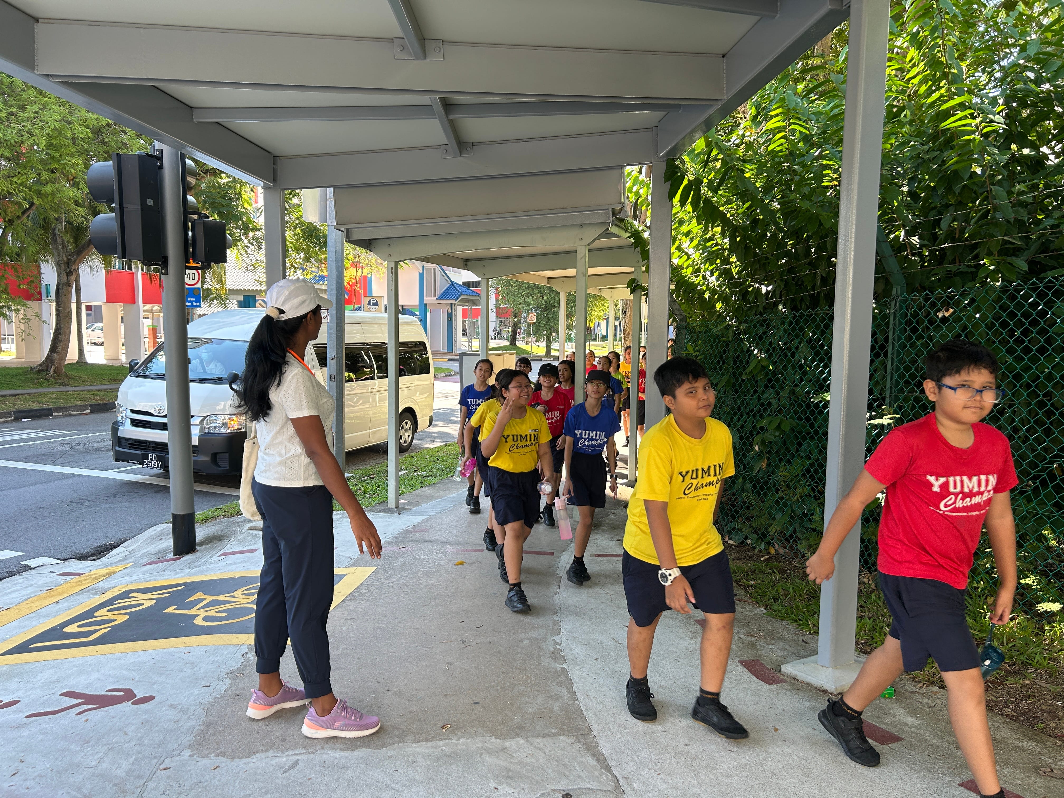 Yumin students having a walk around the neighbourhood during Walk for Health