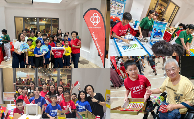 Children and adults at an indoor event with booths, banners, and displays.