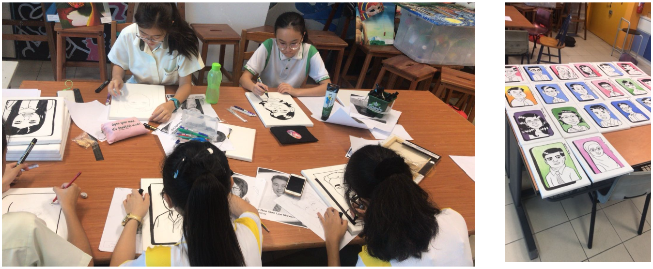 Our students drawing caricatures of school staff; finished colorful portrait cards are displayed on a desk nearby.