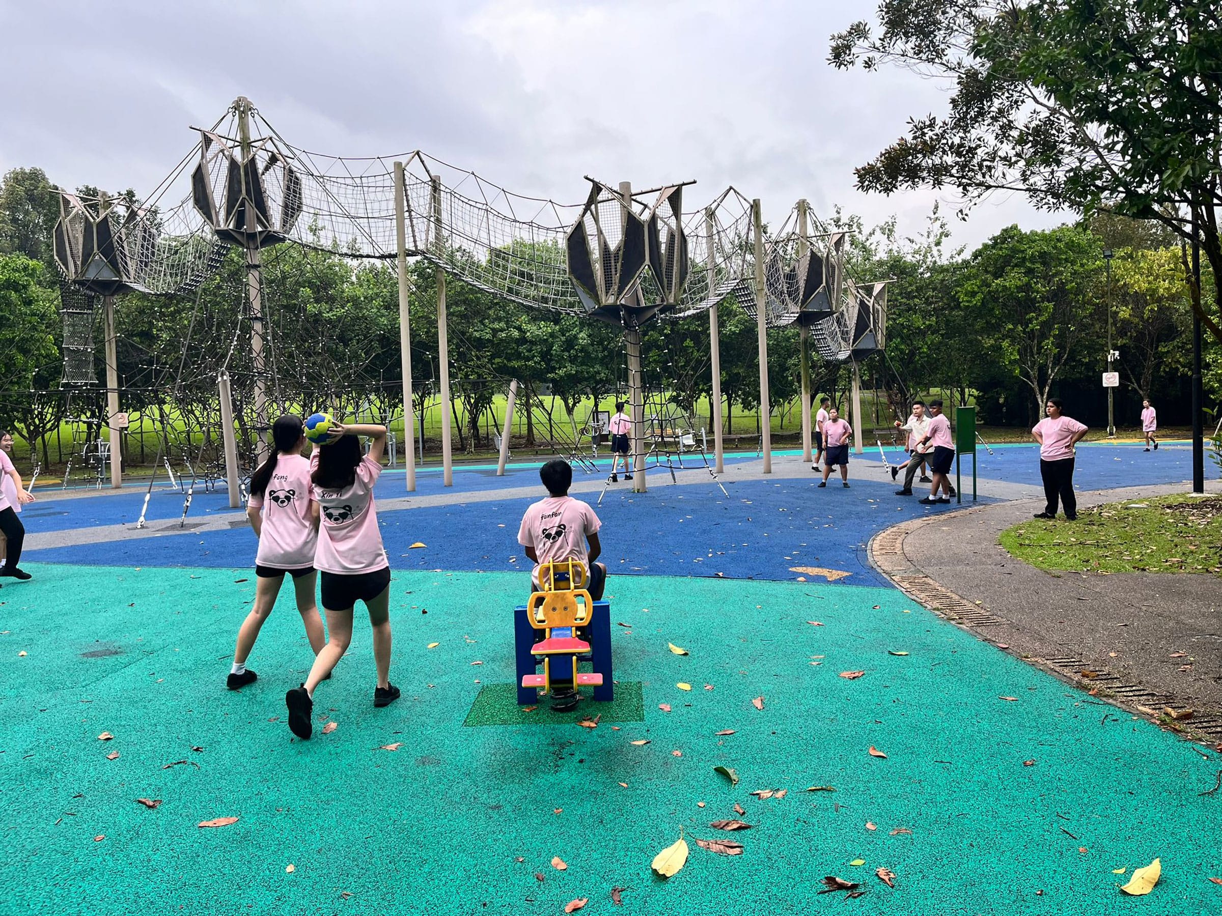 Students winding down and playing games at the park