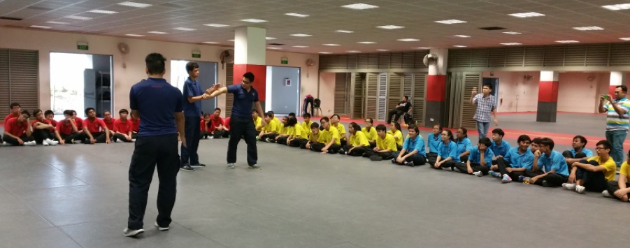 Learning Unarmed Tactics skills from Singapore Police Force.