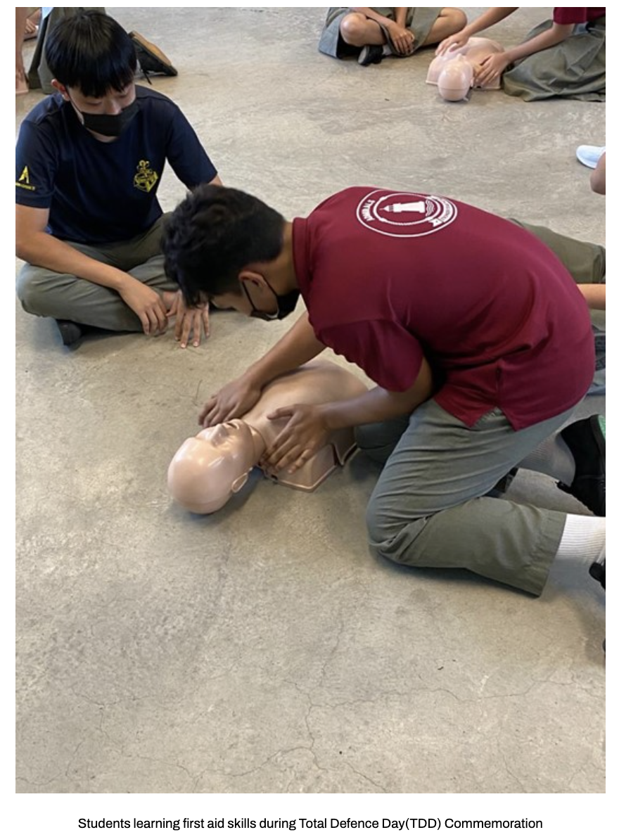 Our students practice CPR chest compressions on mannequins during a first aid training session.