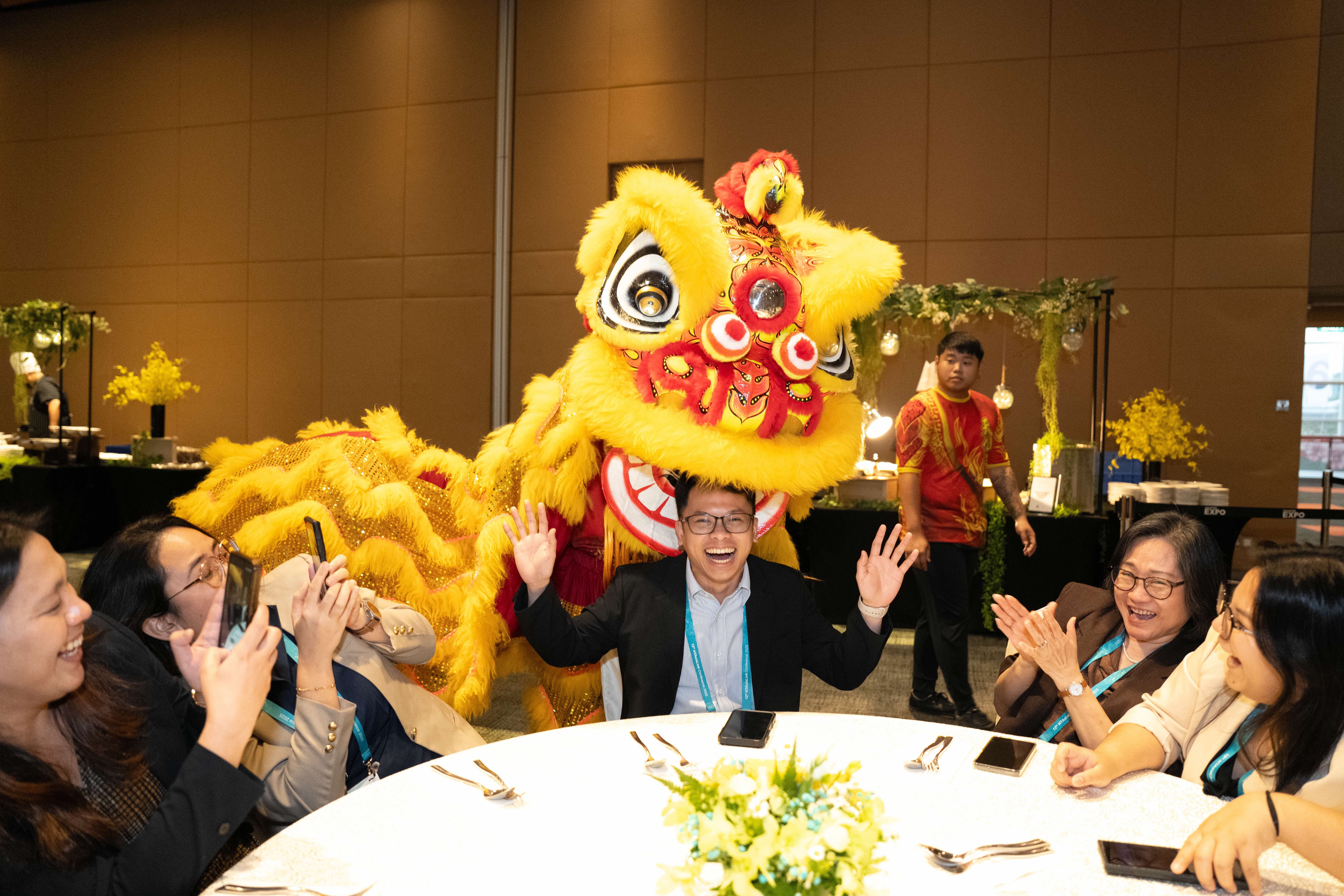 Photo of guests at the Welcome Dinner's Lion Dance Performance