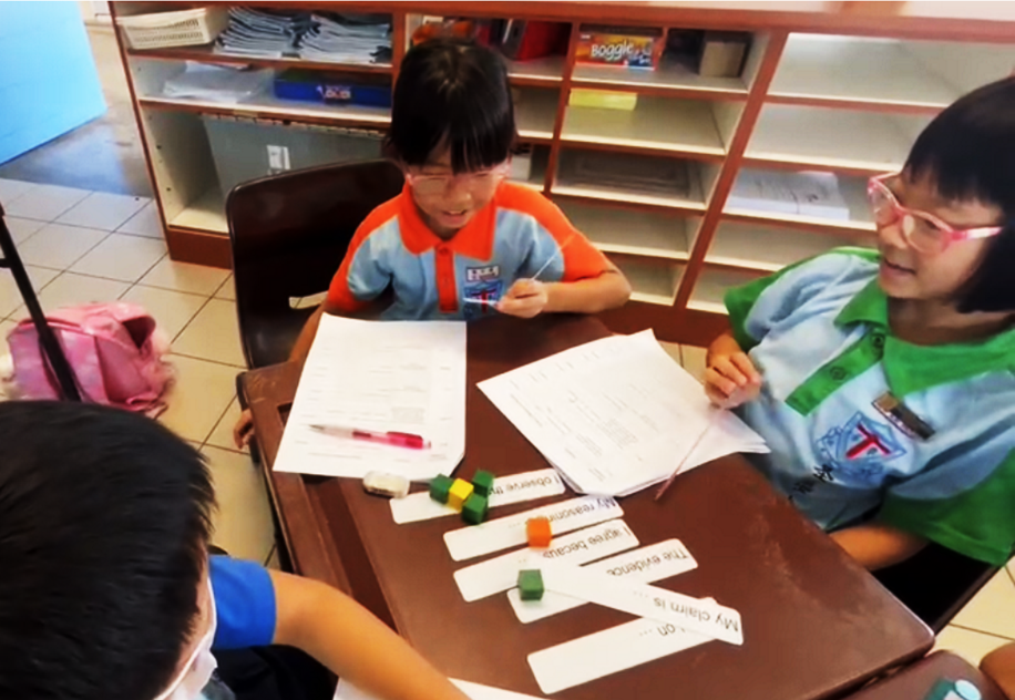 Students engage in discussions through Talk Moves strategies to sharpen their scientific reasoning.