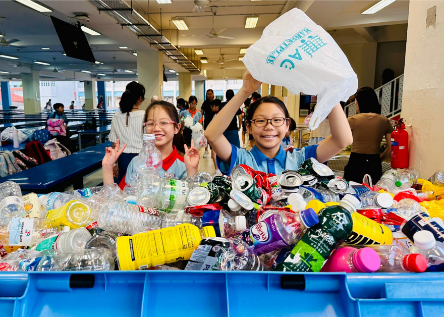Students participate in recycling activities in school to promote environmental sustainability.