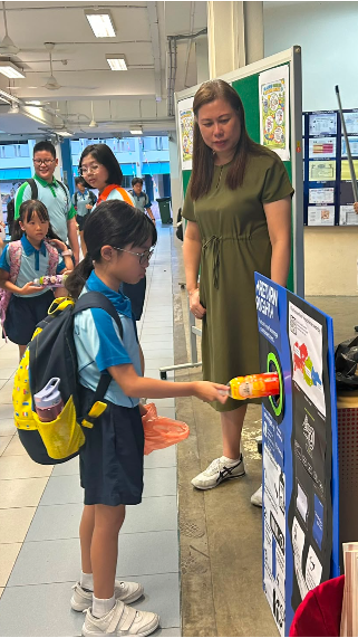 Students participate in recycling activities in school to promote environmental sustainability.