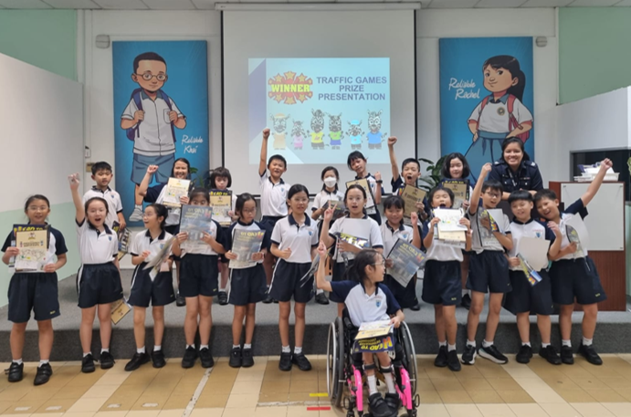 Our P4 students receiving their prizes after participating in the Road Safety Park Traffic Games