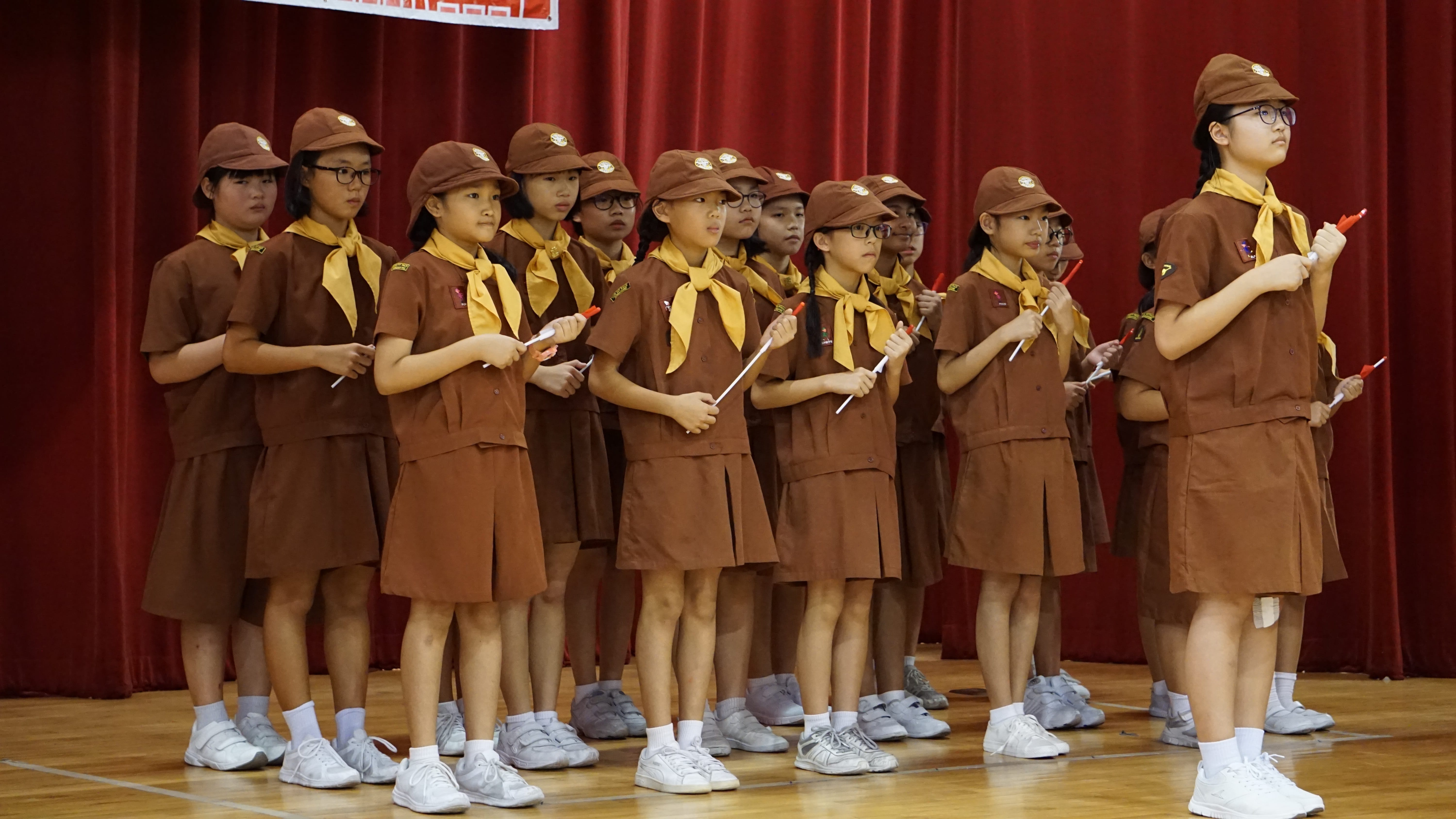 Brownies on stage during National Day celebrations