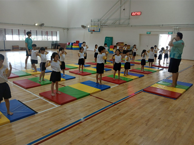 Primary 2 class attending a gymnastics lesson