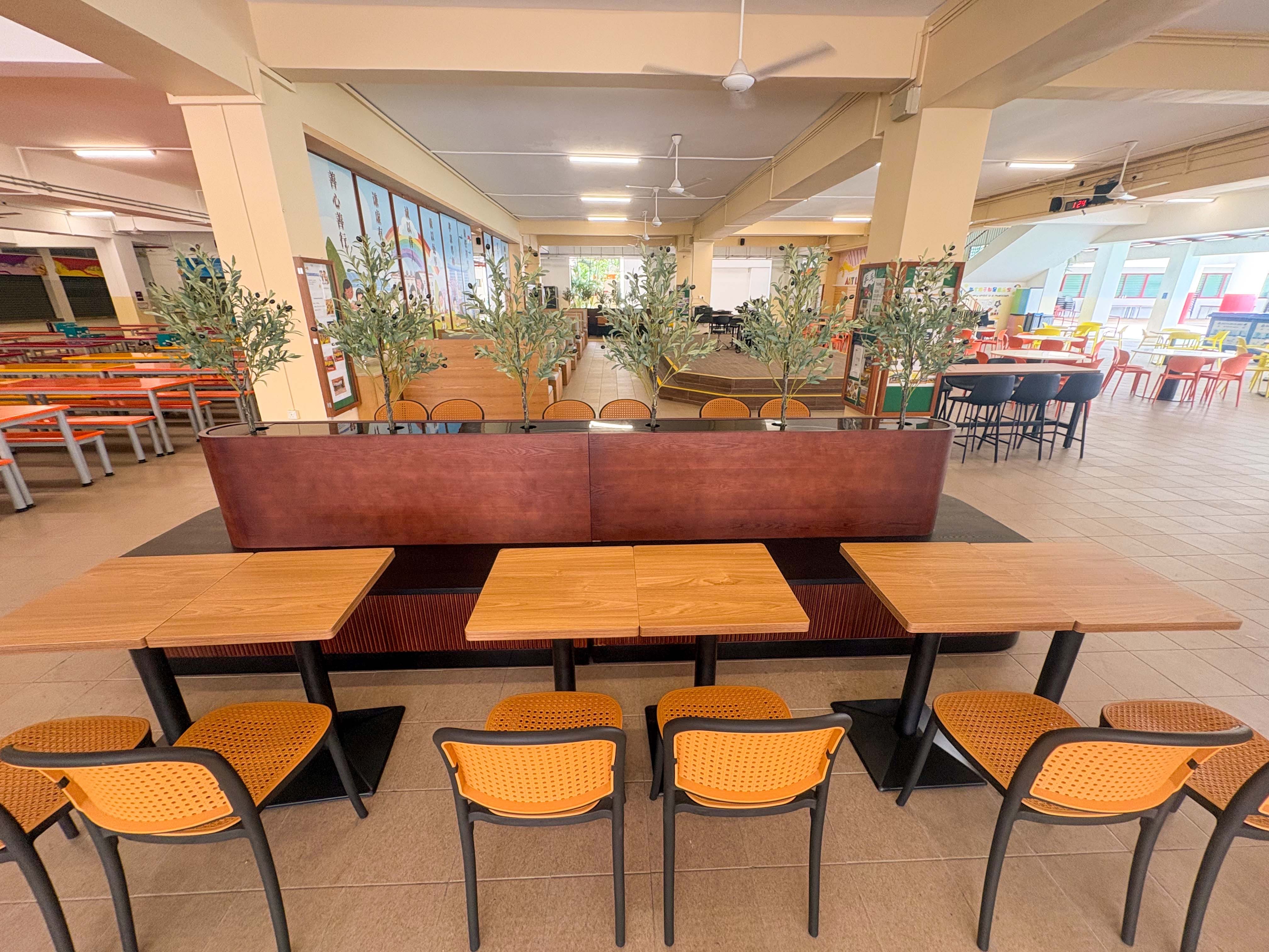school canteen cafeteria style seating arrangement with decorative plants