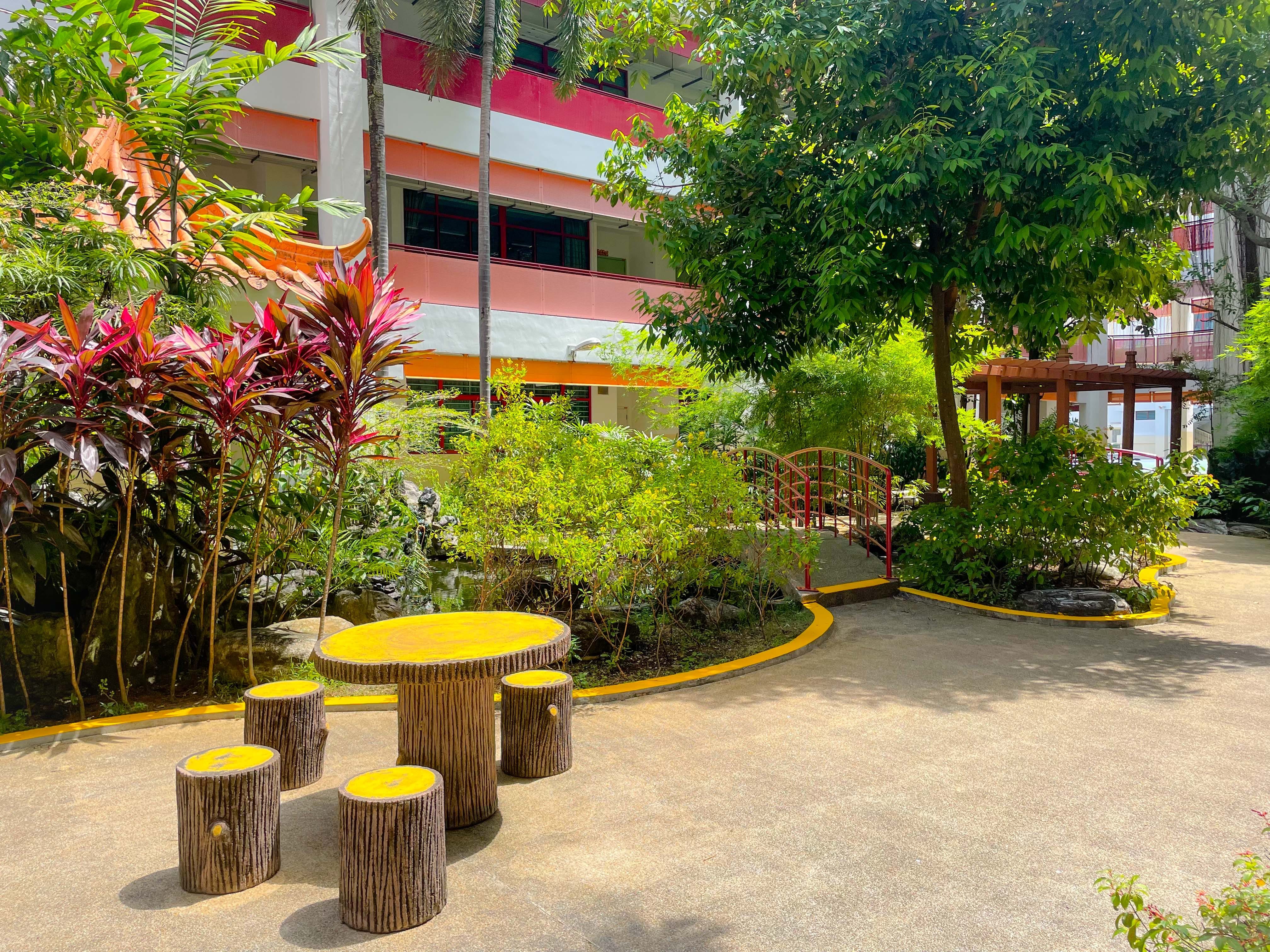 KHS garden with wooden seats and wooden table