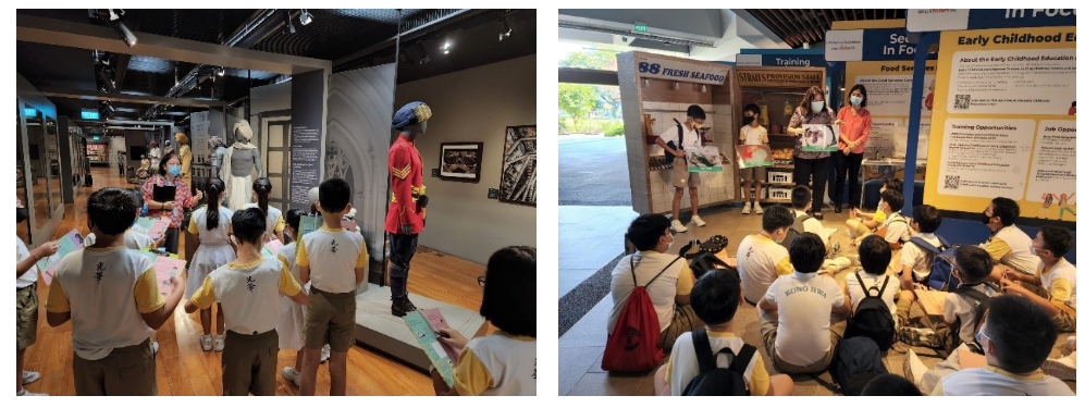 Students in uniform on a museum field trip, viewing displays indoors and sitting on the floor for a presentation.