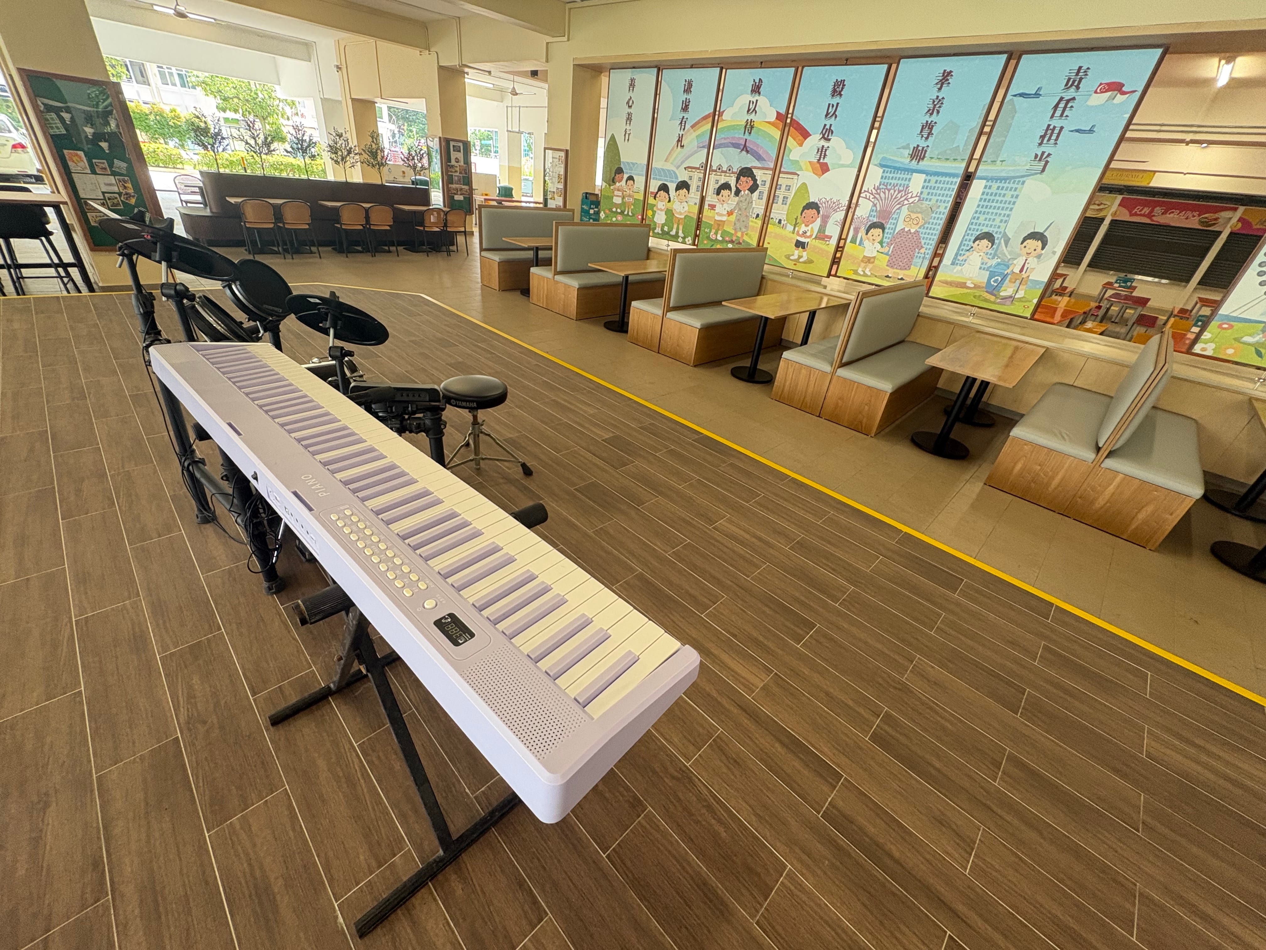 school canteen perfomance platform with digital piano set and drum set