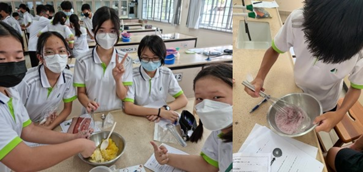 Students in white uniforms and masks mix ingredients in metal bowls during a school lab activity.