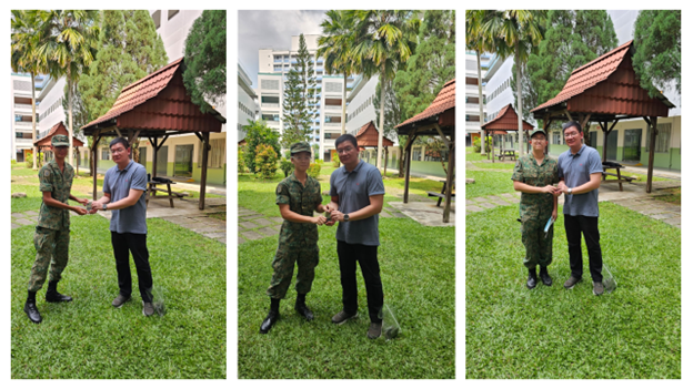 Three pairs of men, one in camouflage uniform and one in casual clothes, shake hands outdoors near a gazebo on green grass.