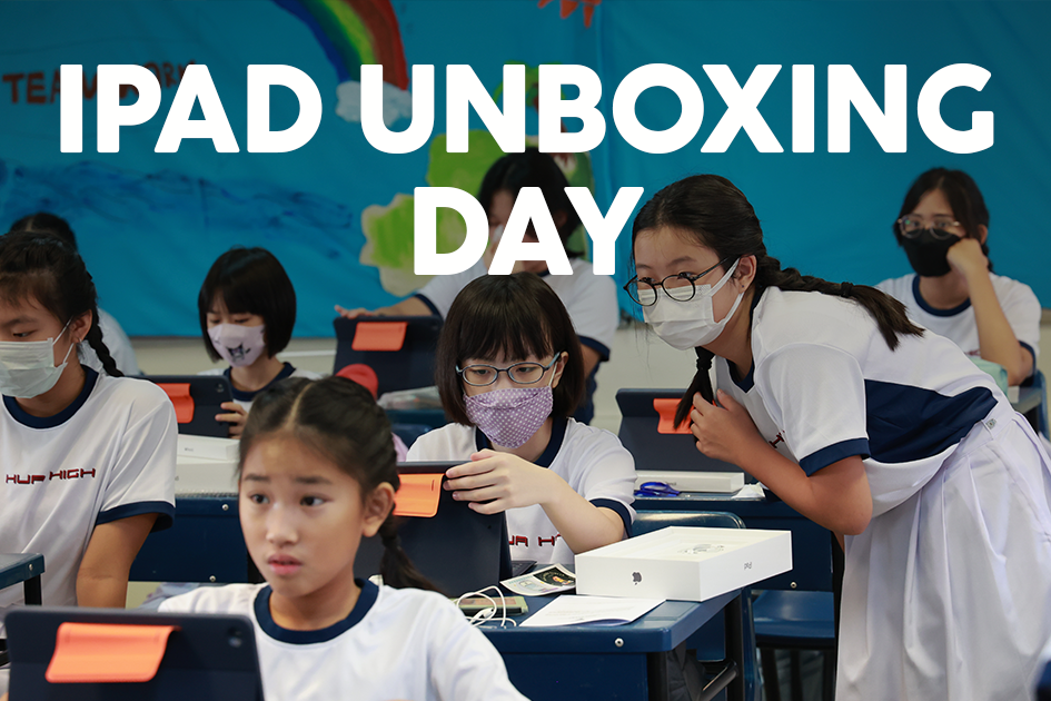 Students in uniforms and face masks unbox iPads in a classroom, with bold text reading IPAD UNBOXING DAY.