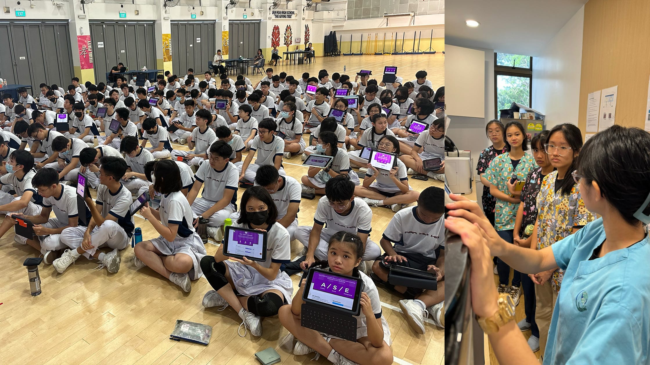 Large group of students in white uniforms sit on a gym floor holding tablets, beside a smaller group with an adult.