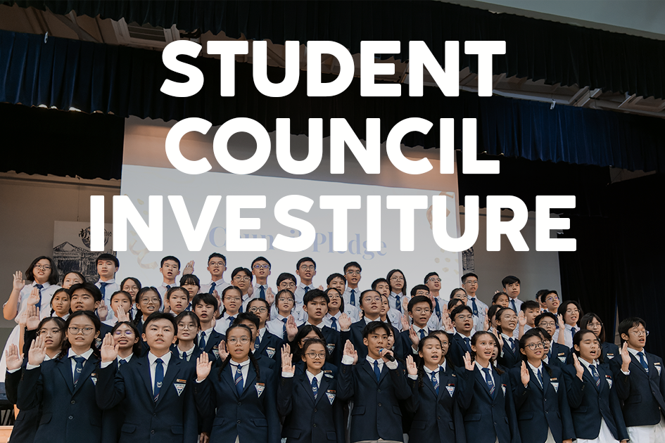 Students in navy blazers raise their right hands during a Student Council Investiture ceremony on a school stage.