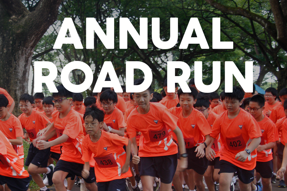 A large group of youth in orange shirts with race numbers run outdoors under trees, with text reading Annual Road Run.