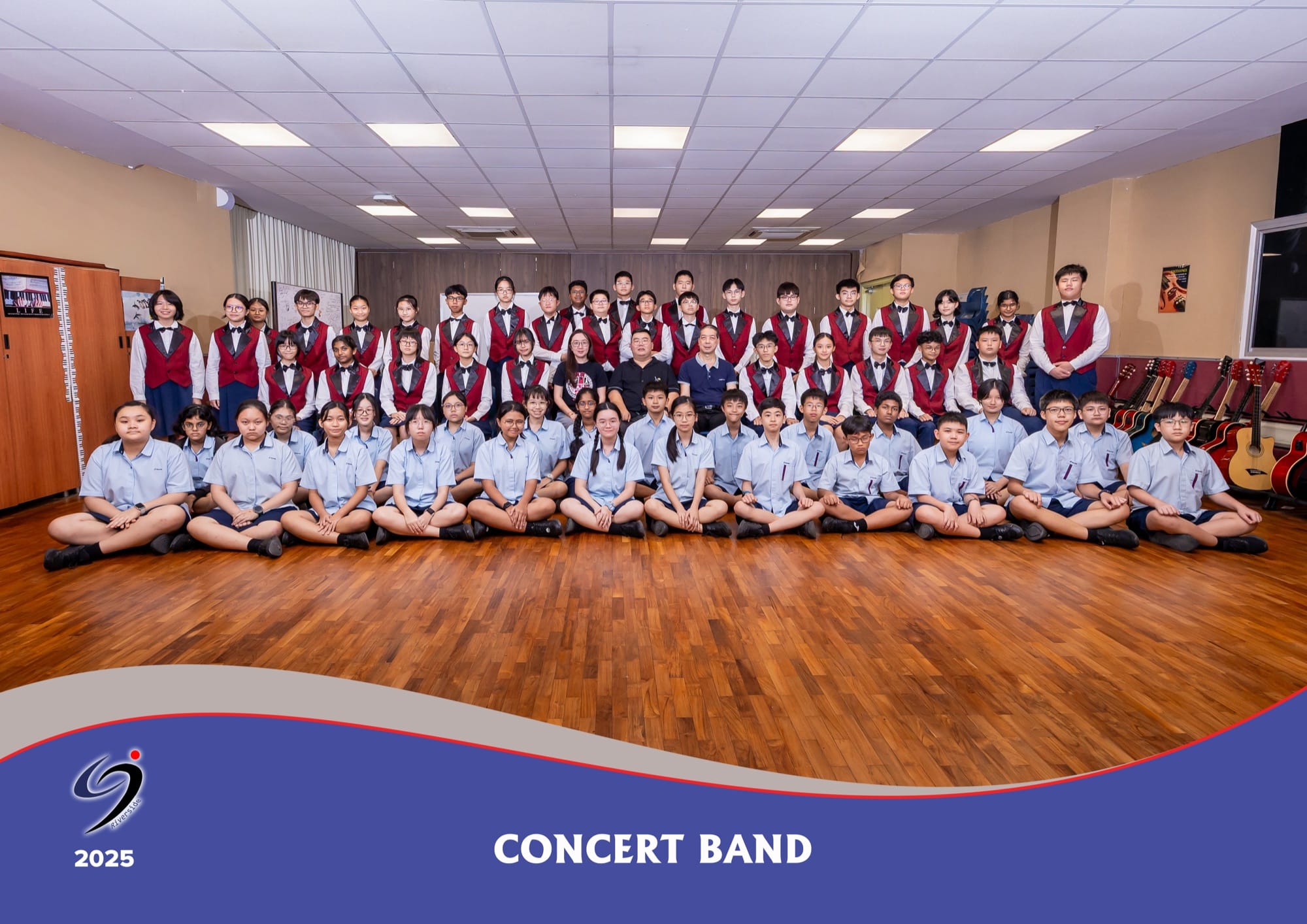 The Concert Band with their instruments and teachers-in-charge, in a 2025 group photo.