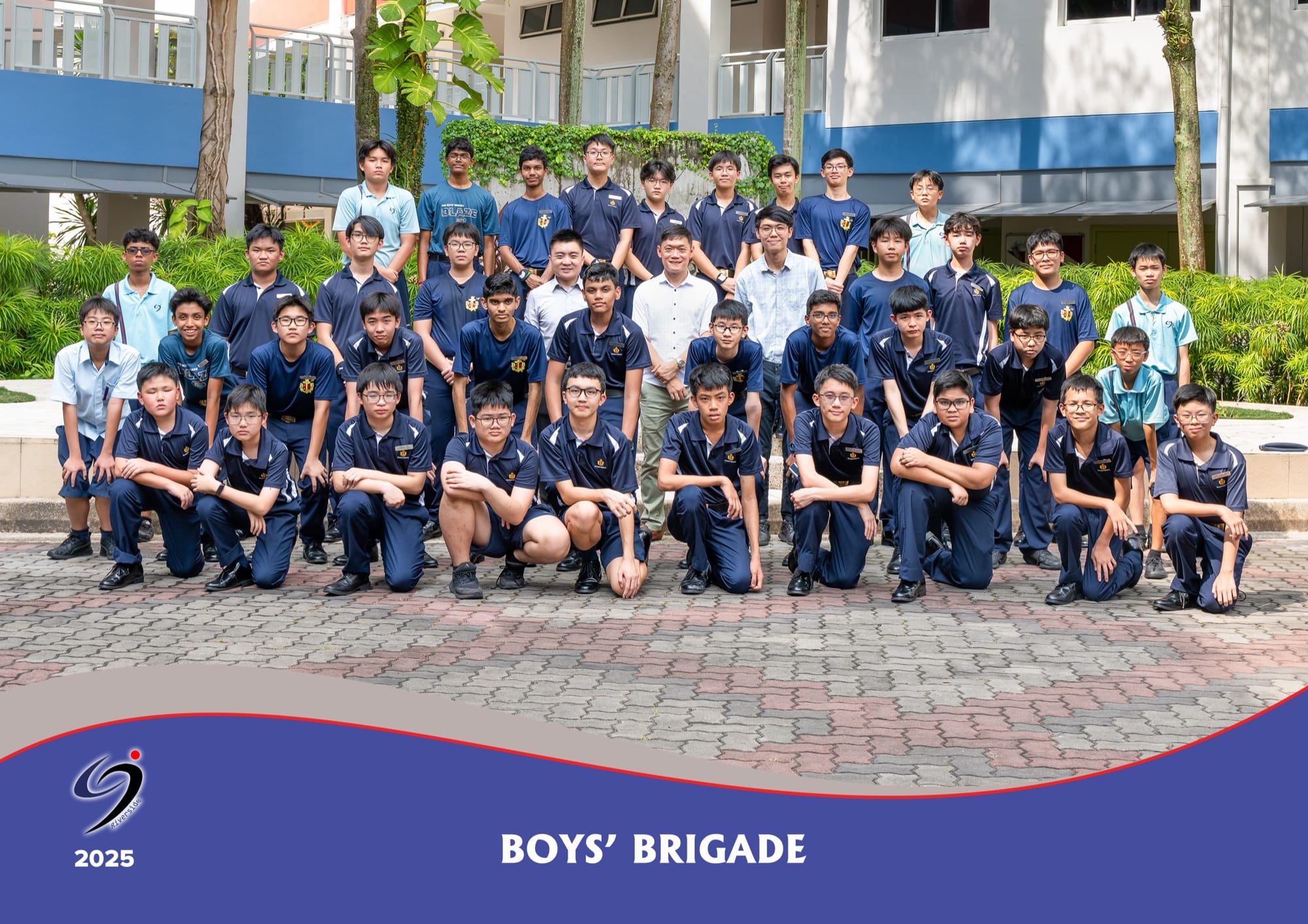 The Boys' Brigade company in uniform with their teachers-in-charge, in a 2025 group photo.