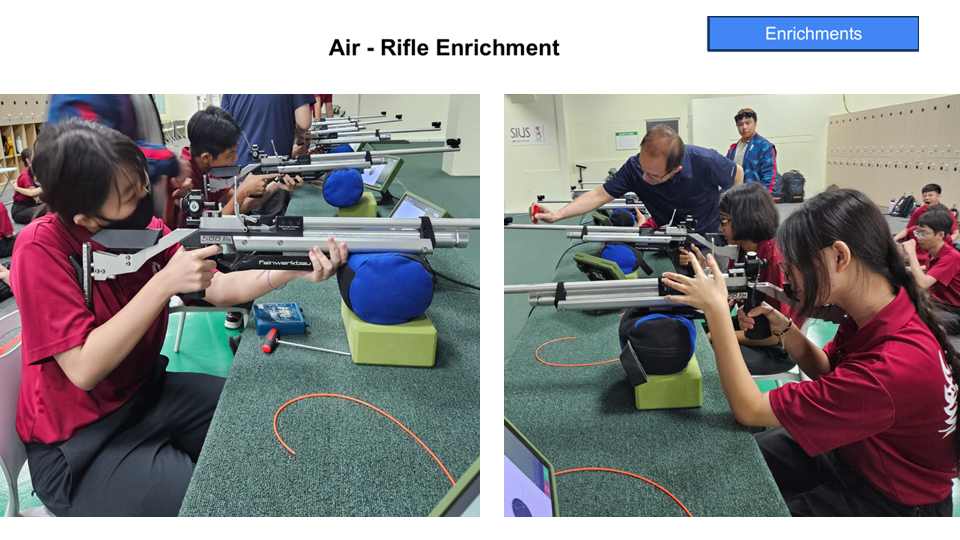 Students in red uniforms practice aiming air rifles on a shooting range during an enrichment activity.