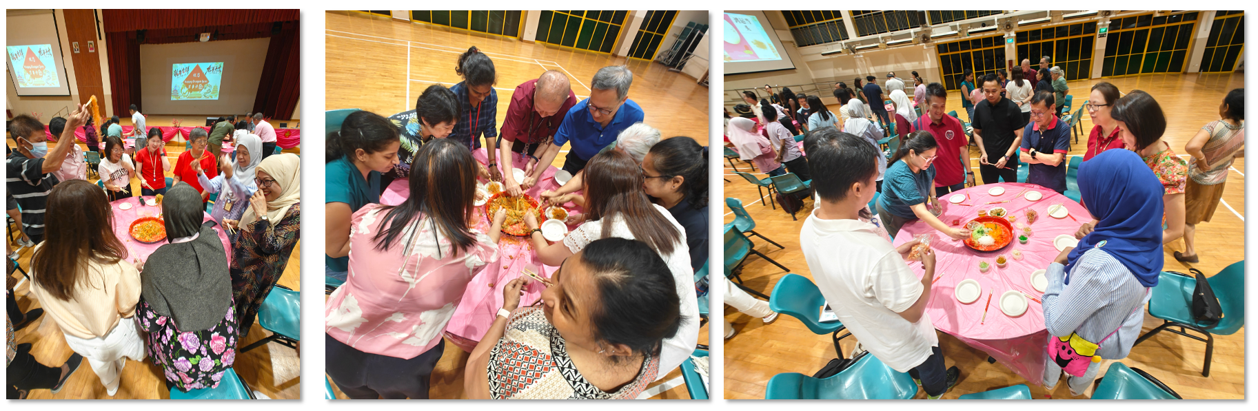 Groups of people gather around pink-clothed round tables in a hall, tossing and sharing food together.
