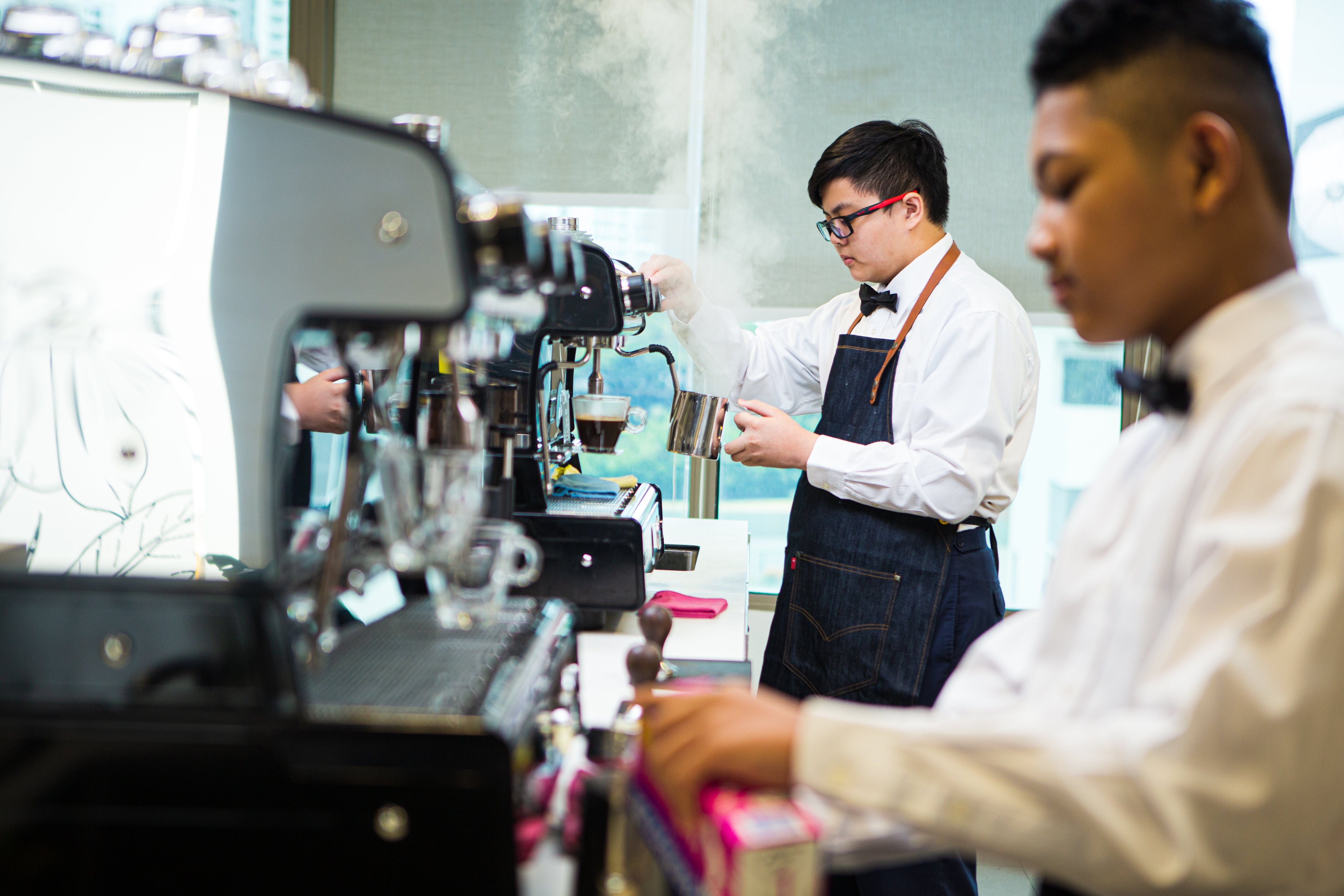 students using coffee machine