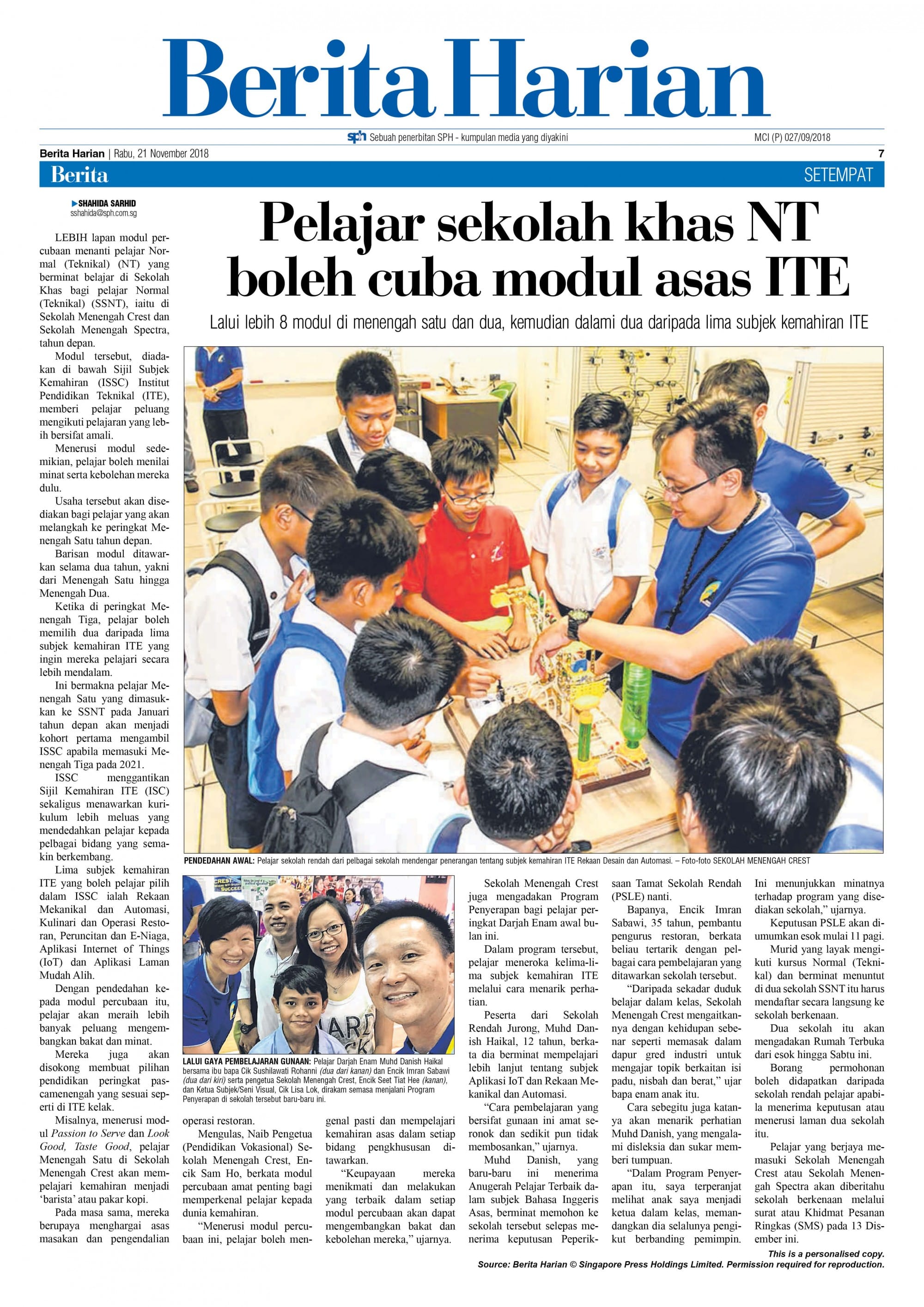 Berita Harian newspaper page dated 21 November 2018 with a headline and photo of students gathered around a table.