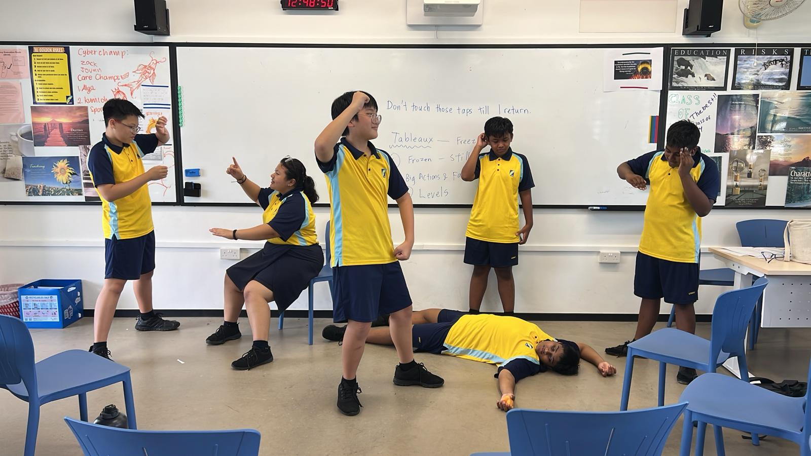 students in a performance inside a classroom