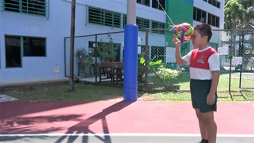 A simple test to prove that energy conversion of the free-swinging ball will ensure that it can never hit the student’s head once released.