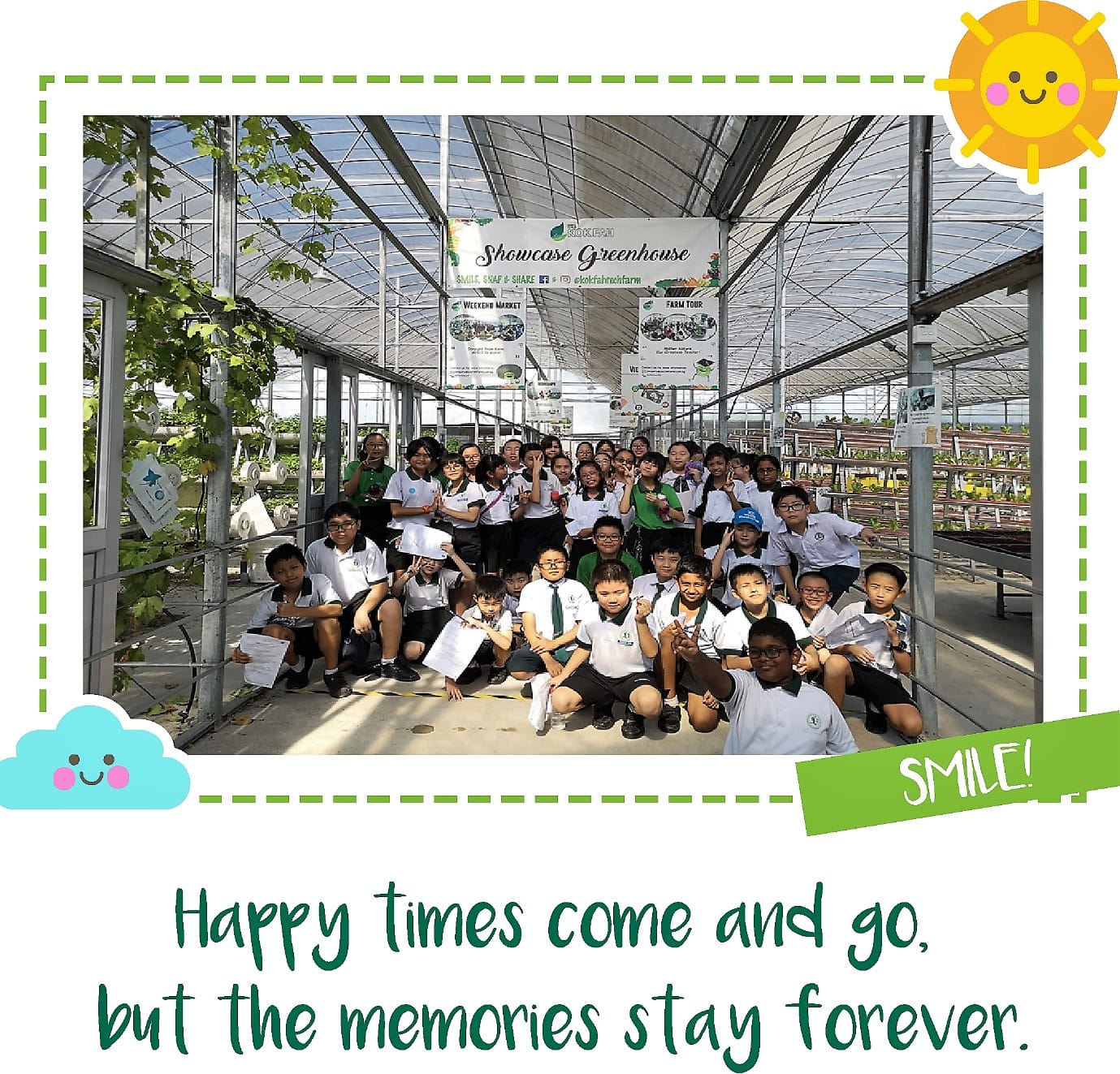 A group of school children in uniforms pose together inside a greenhouse during a farm tour field trip.