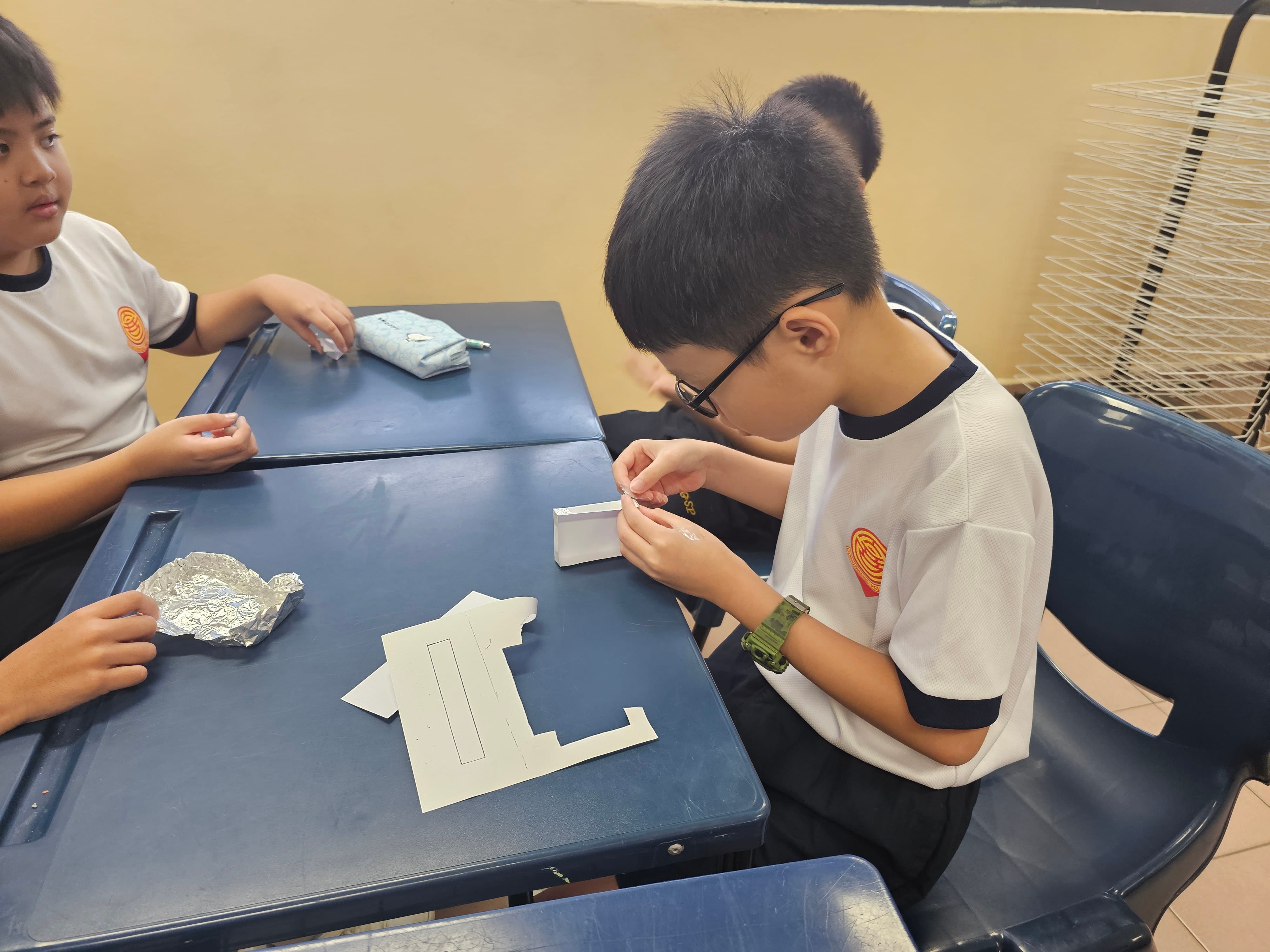 Students constructing model hulls